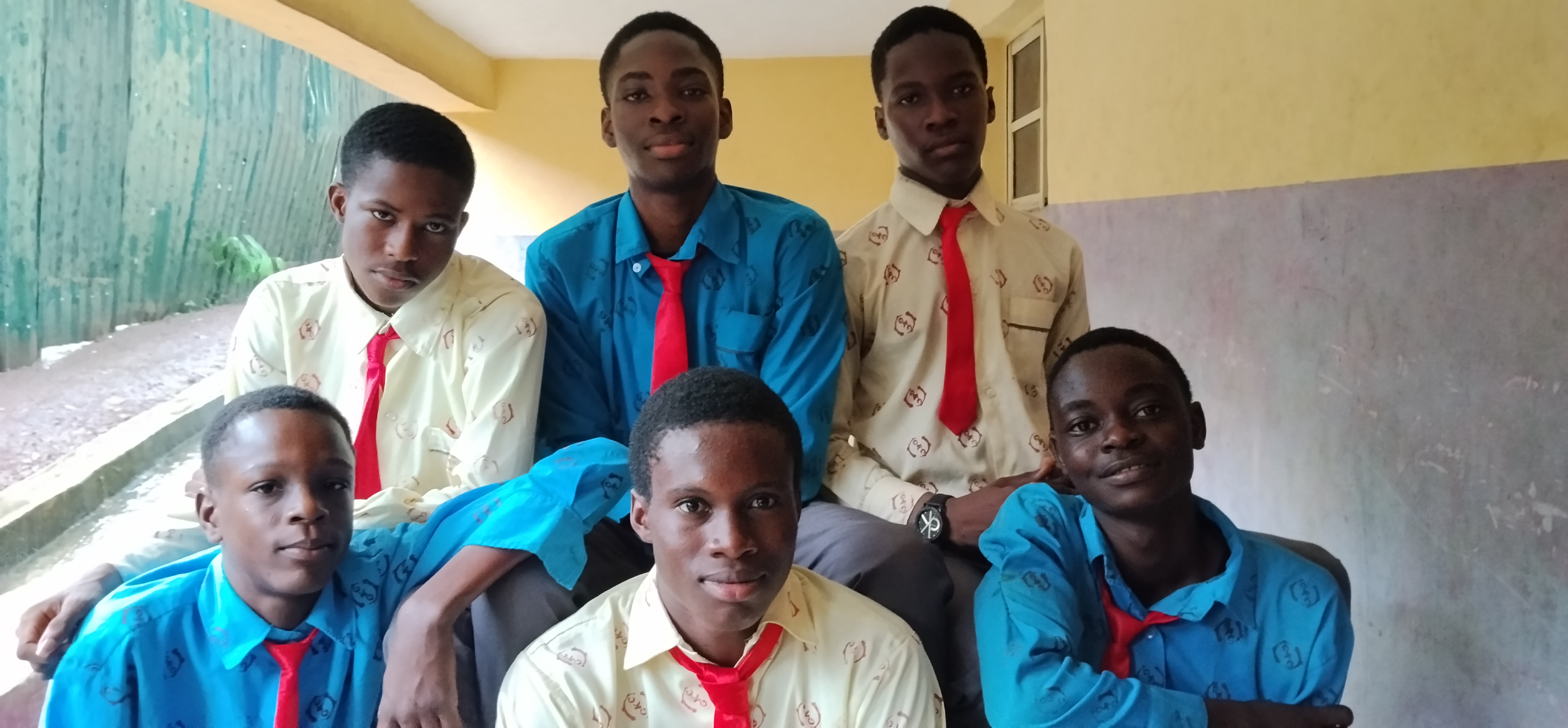 Male Secondary Scholars in Blue and Cream Uniforms
